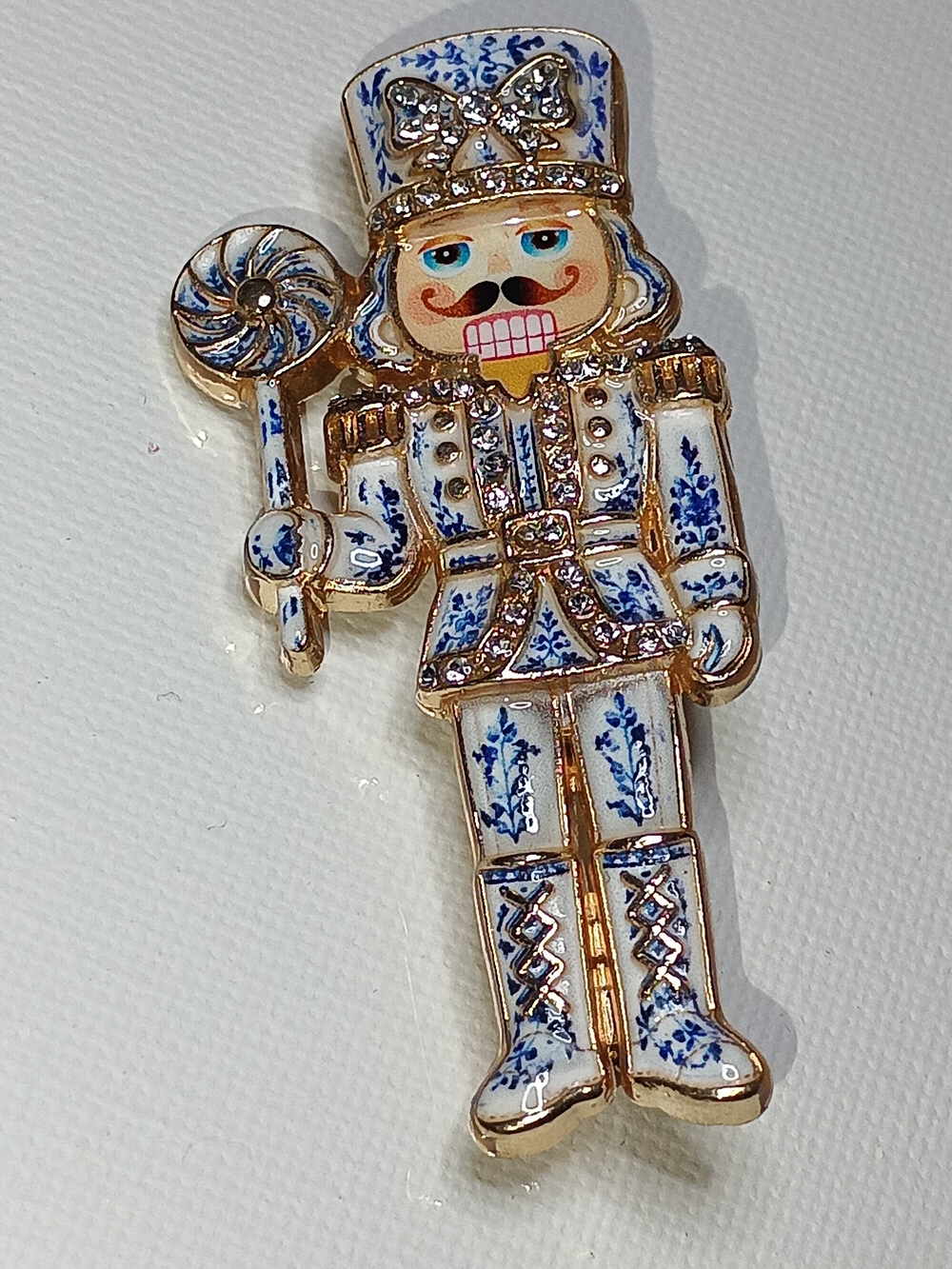 Blue and White Nutcracker Brooch with Gold Accents